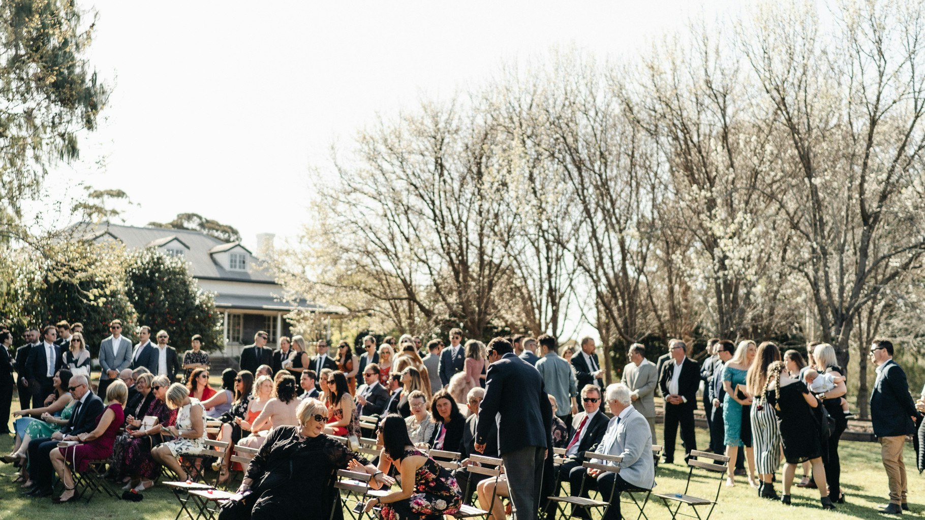 Wedding guests gather for a ceremony.